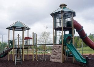The completed playground equipment at River Park is officially opened after today's Ribbon Cutting Ceremony, park