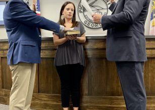 Josh Tippens is being sworn in as West End District One Commissioner